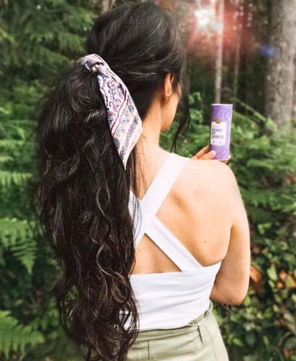 curly ponytail - #1b natural black. - 14 inches